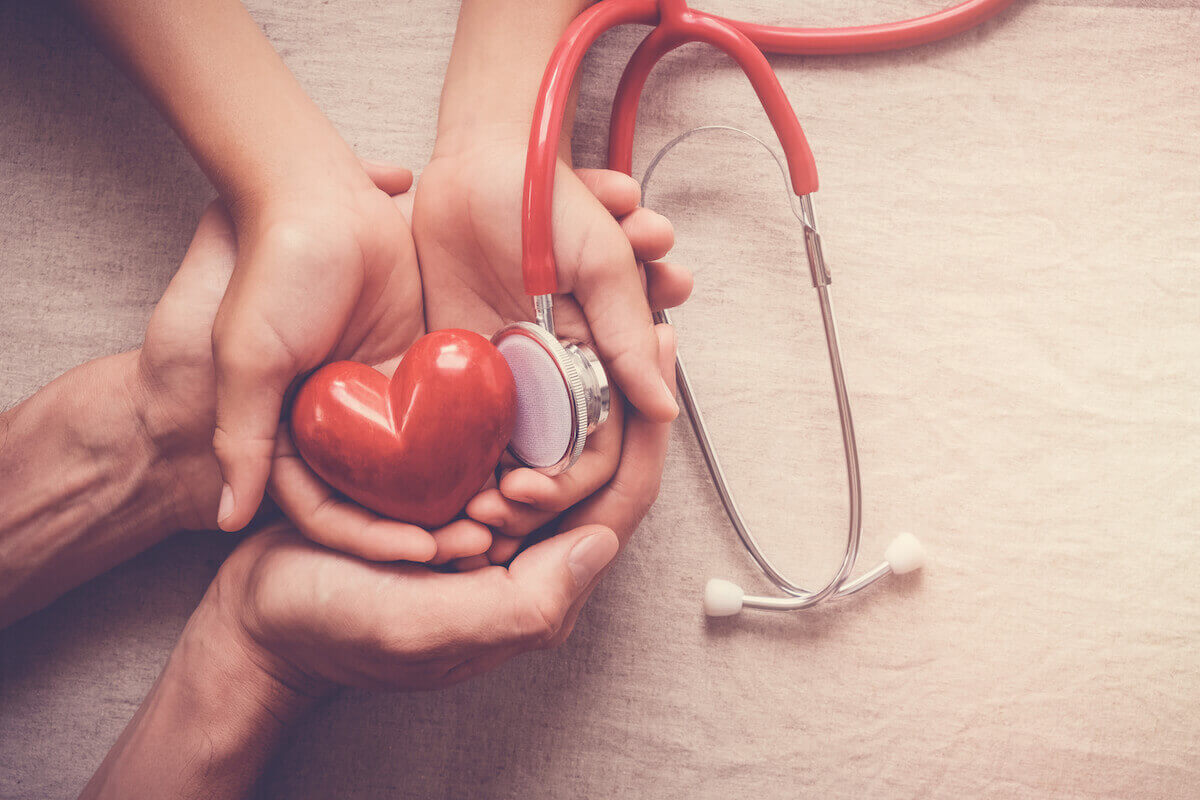 hands with a heart and stethescope